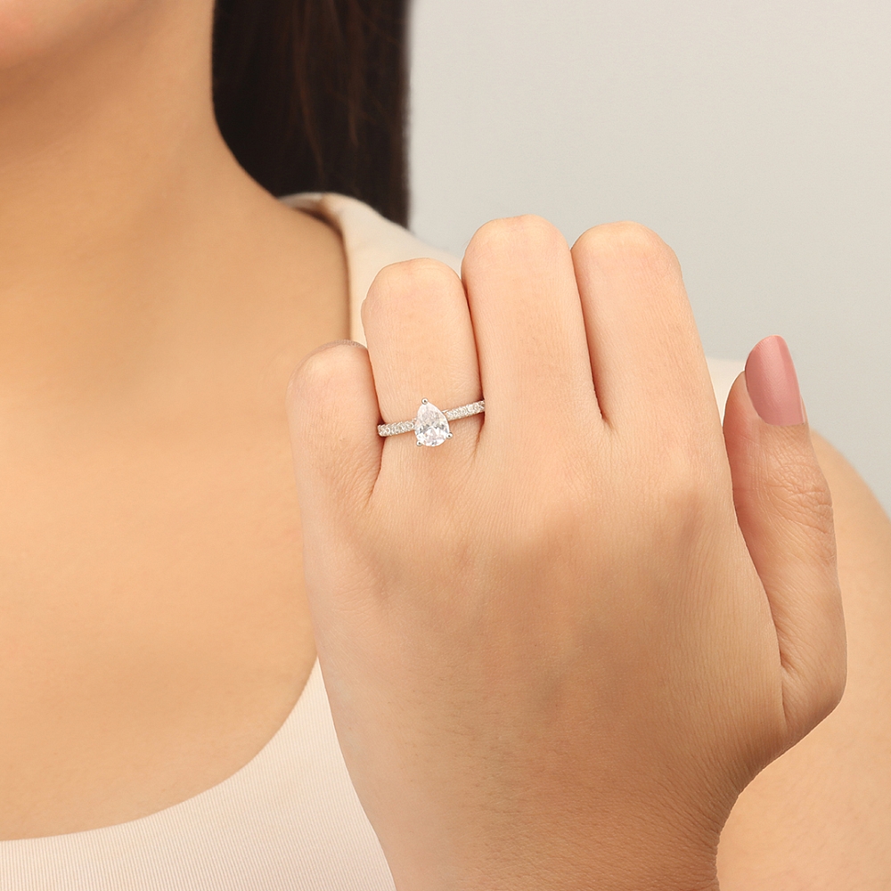 Pear Prong set side stone Engagement Rings