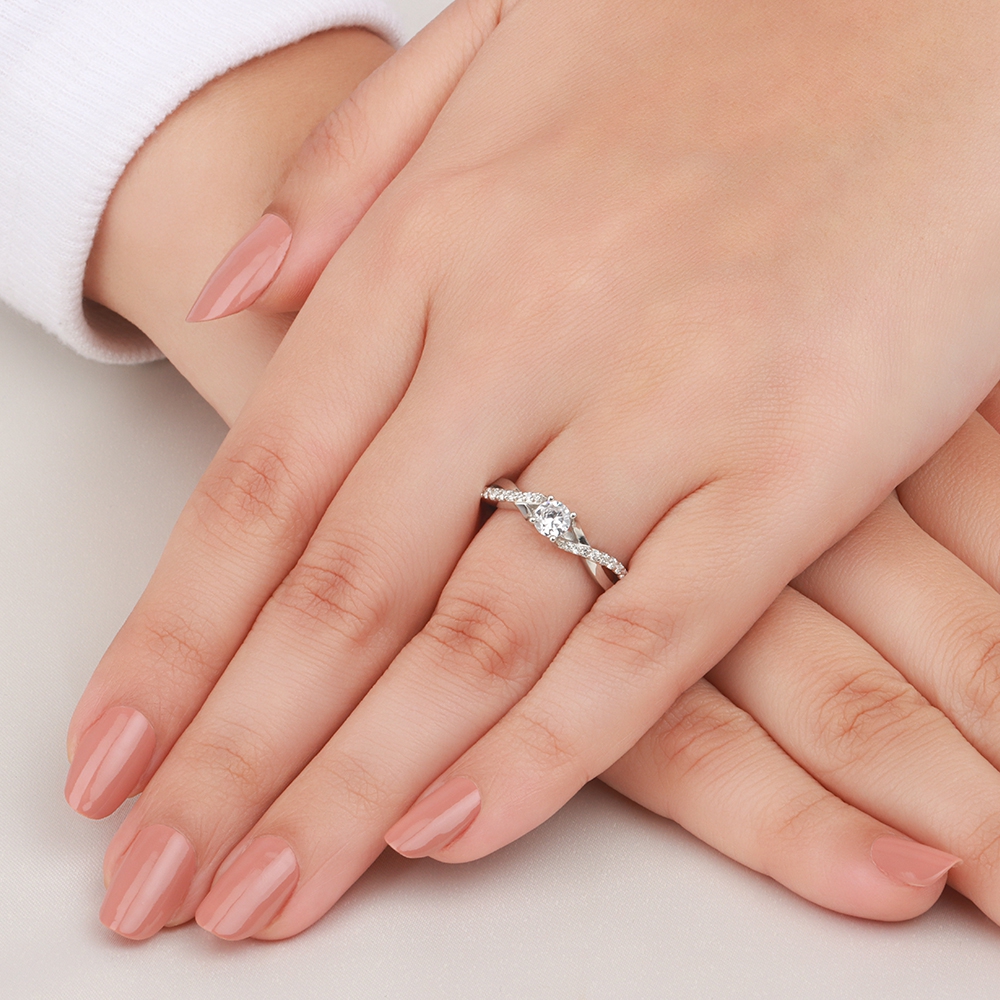 4 Prong Round Platinum Side Stone Engagement Ring