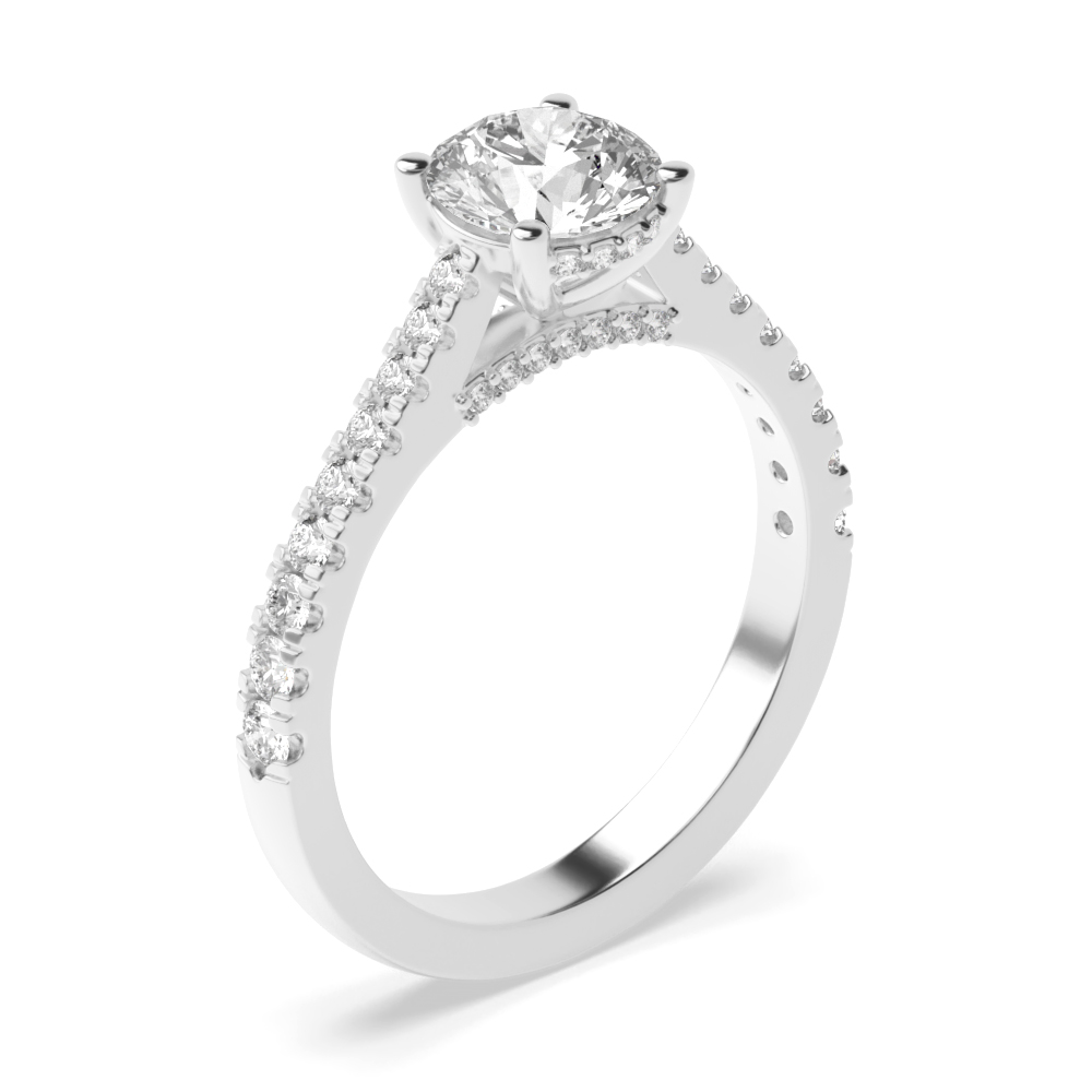 a beautiful round brilliant cut diamond ring with side and shoulder stones ring