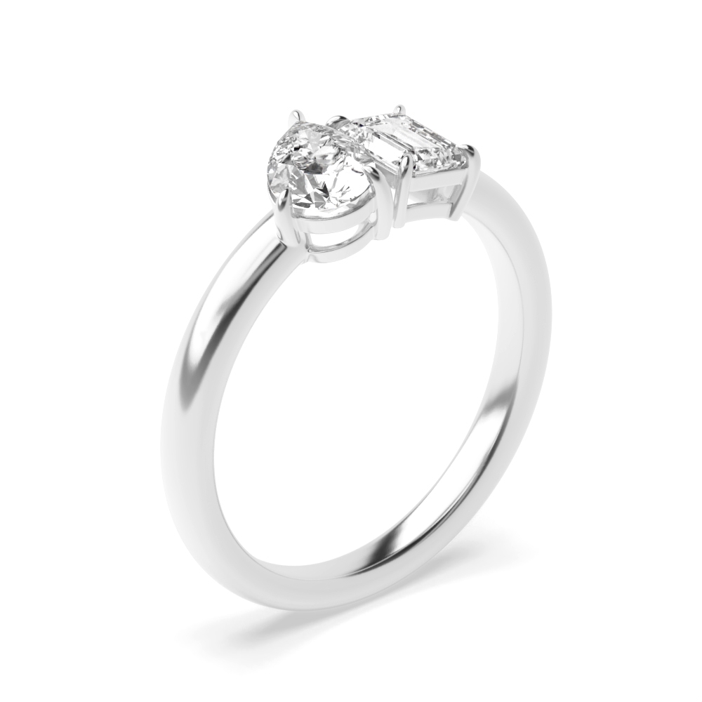 prong setting emerald and pear shape two stone ring