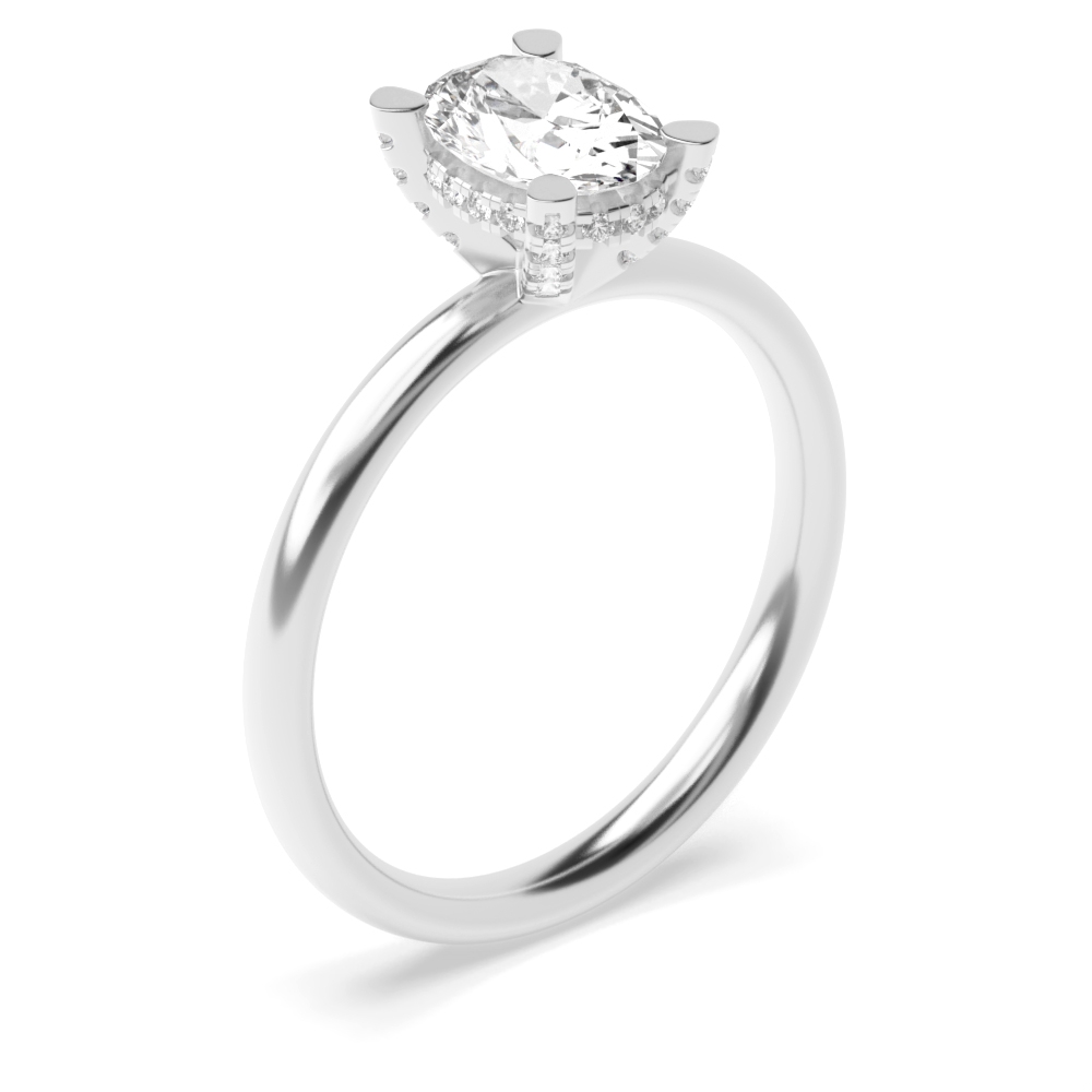 A dazzling oval-shaped diamond nestled in a 4-claw setting a hidden halo engagement ring