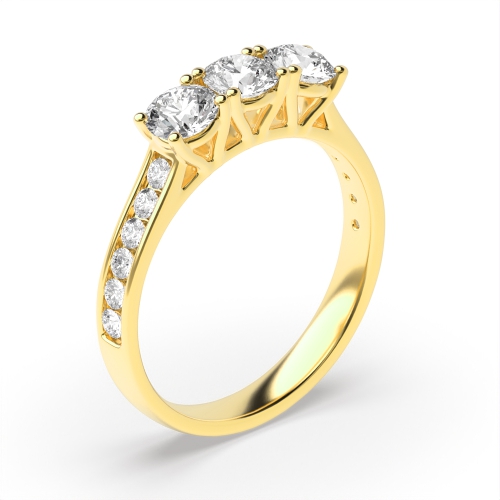 4 Prong Round Yellow Gold Channel Set side Three Stone Engagement Ring