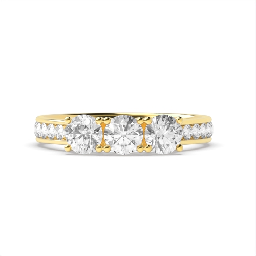 4 Prong Round Yellow Gold Channel Set side Three Stone Engagement Ring