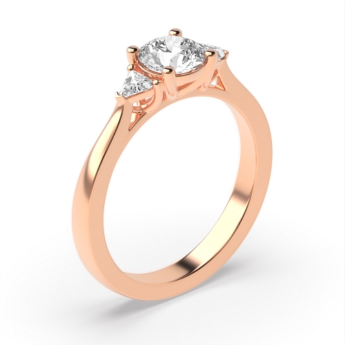 Round/Trillion Rose Gold Raised set Trilogy Engagement Rings