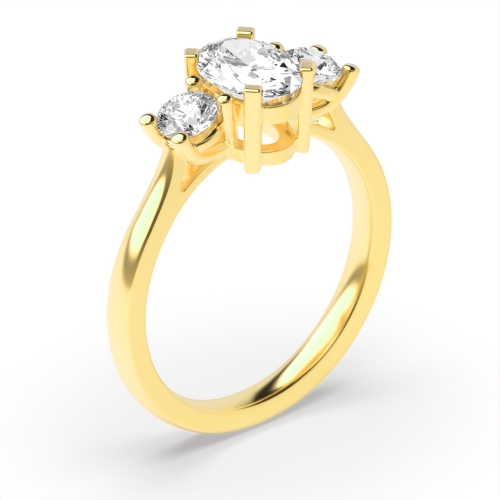 4 Prong Oval Yellow Gold And round graduated Trilogy Engagement Rings