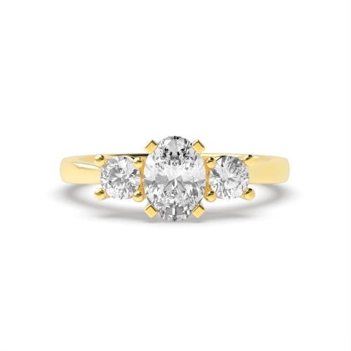 4 Prong Oval Yellow Gold And round graduated Trilogy Engagement Rings