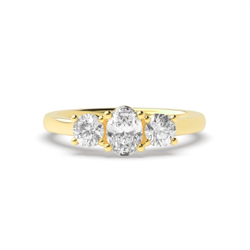 4 Prong Oval Yellow Gold With round graduated Trilogy Engagement Rings