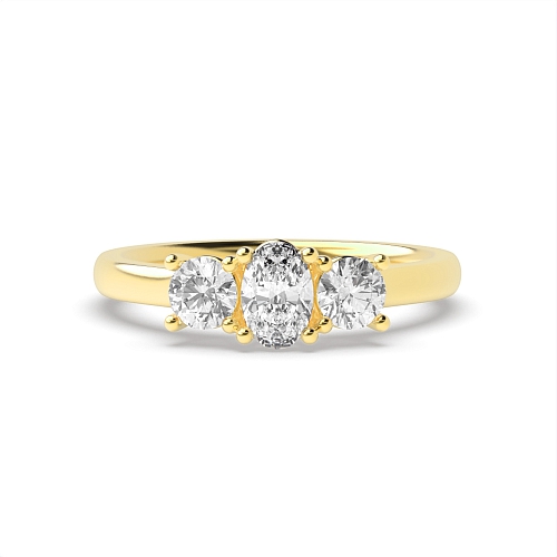 4 Prong Oval Yellow Gold And Round raised set Trilogy Engagement Rings