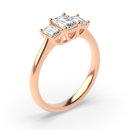 prong setting emerald  trilogy diamond engagement ring